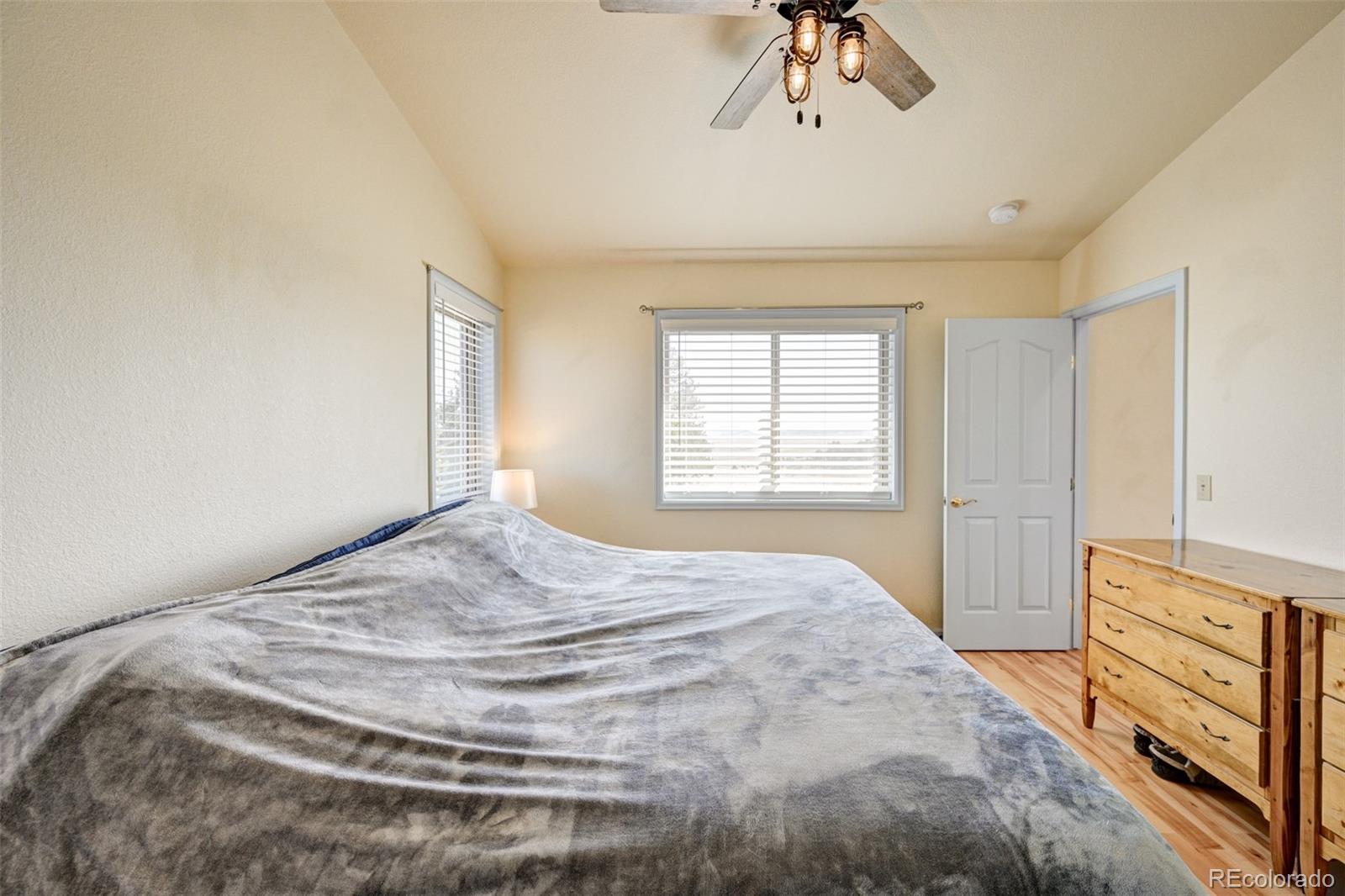 9473 Ranch Road Hartsel, CO 80449 - Photo 19 of 50 a bedroom with a bed and a dresser