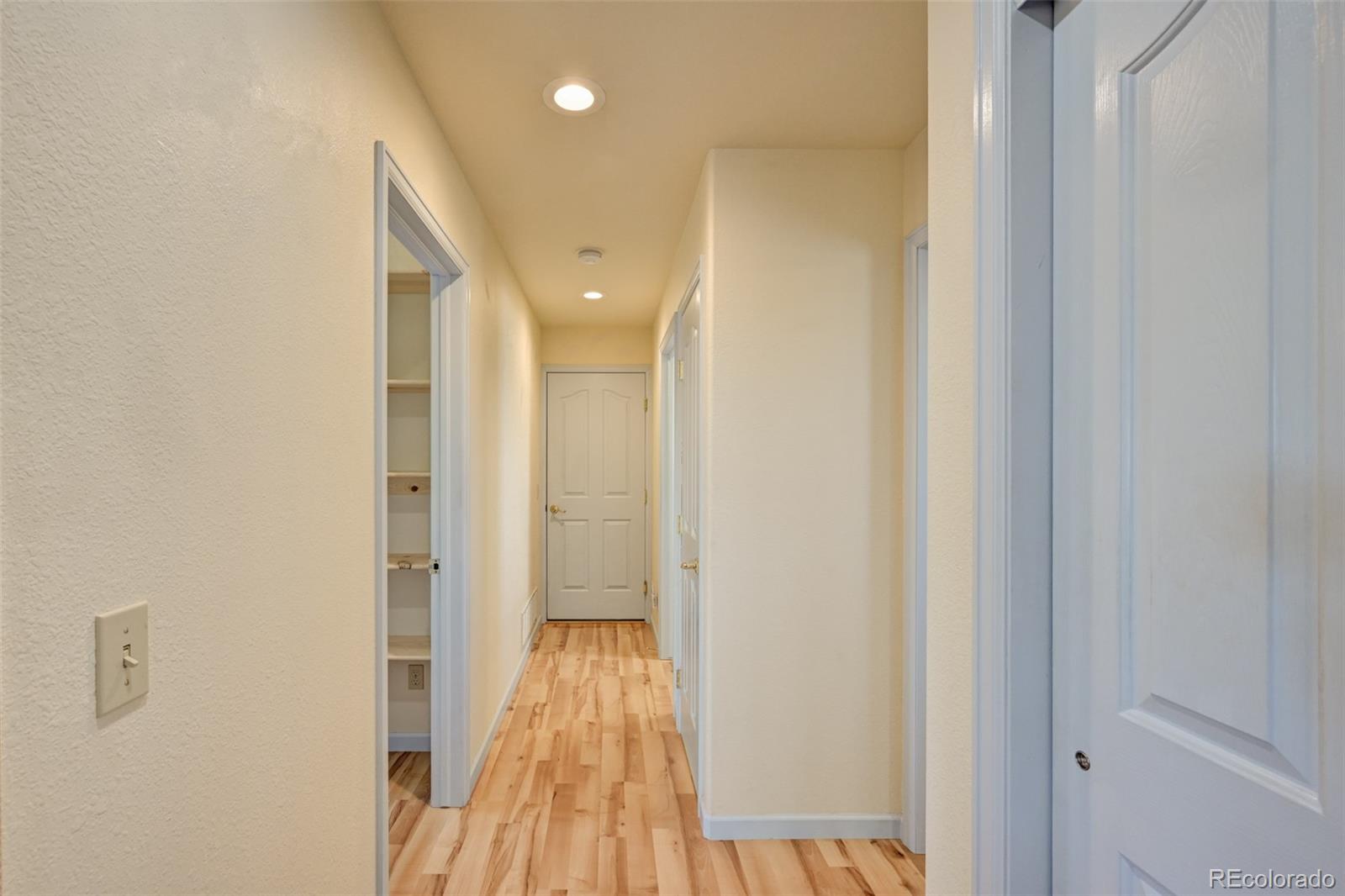 9473 Ranch Road Hartsel, CO 80449 - Photo 20 of 50 a view of a hallway with wooden floor