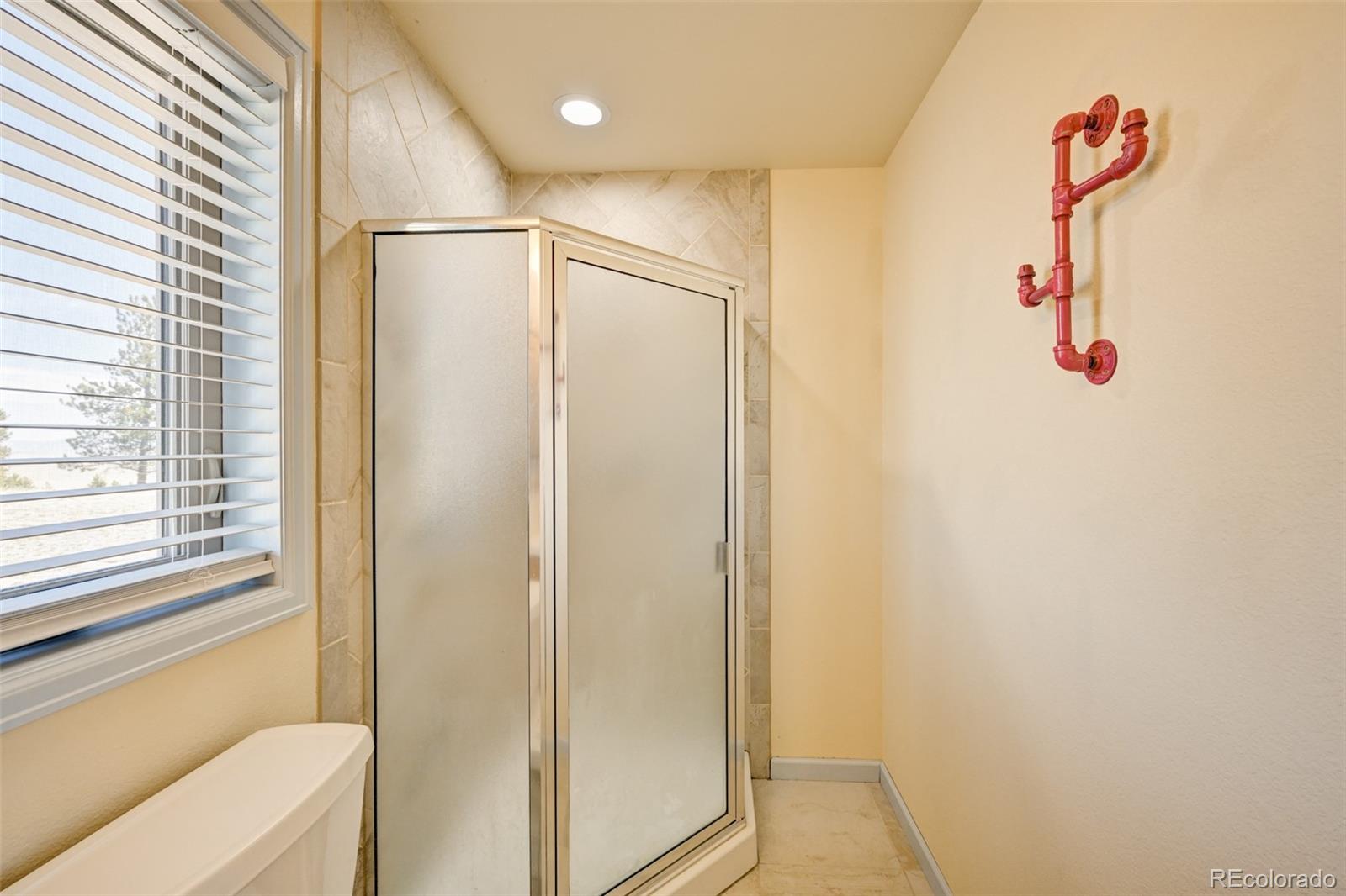 9473 Ranch Road Hartsel, CO 80449 - Photo 25 of 50 a bathroom with a shower and a sink