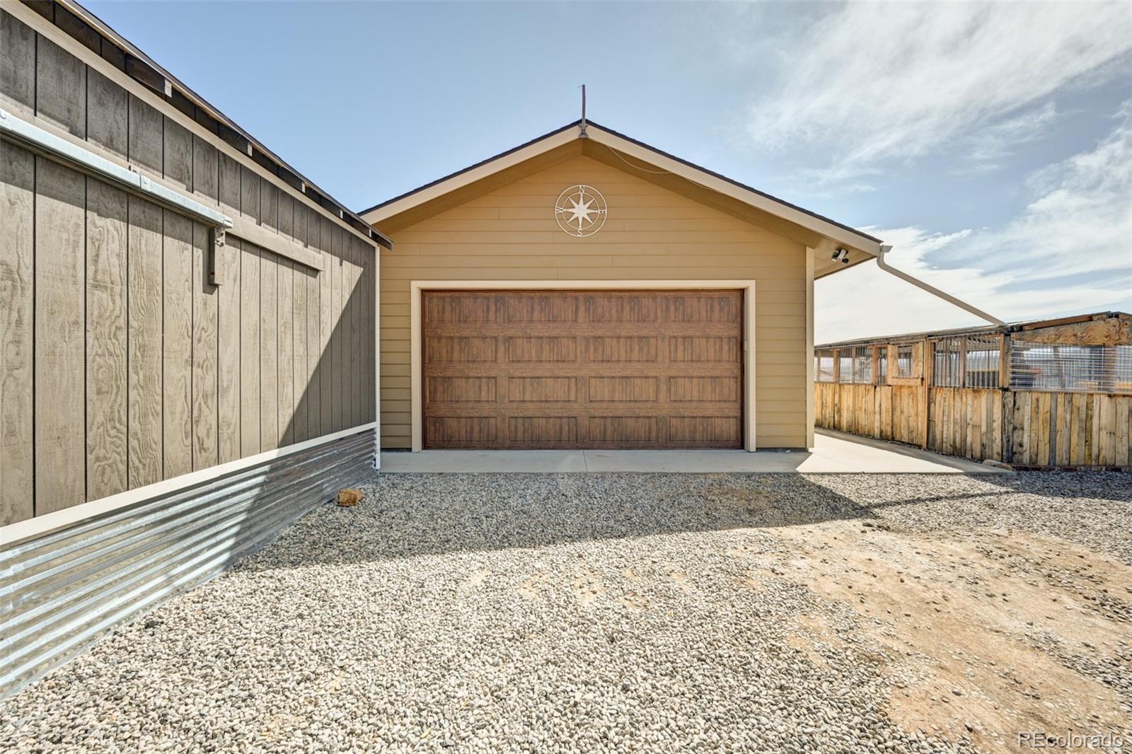 9473 Ranch Road Hartsel, CO 80449 - Photo 39 of 50 a front view of a house with a garage