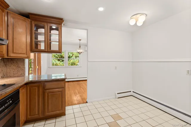 a kitchen with a sink cabinets and window