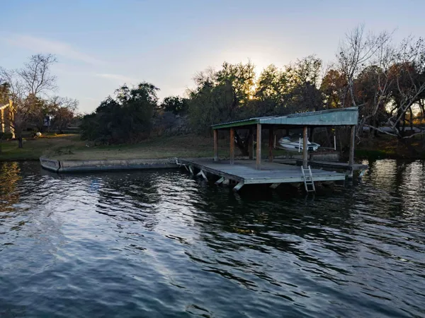 a view of a lake with a house in the background