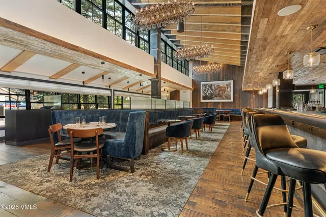 a view of a patio with a table and chairs