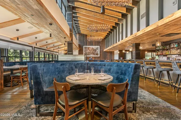 a view of a patio with a table and chairs