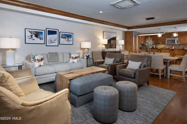 a living room with furniture or couch and a large window