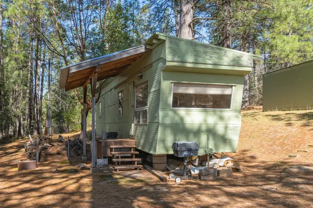 a view of living room with furniture and a fireplace