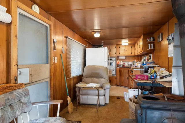 a view of a barn in the middle of a yard