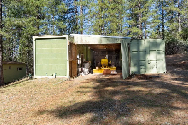 a view of walk in closet with clothes