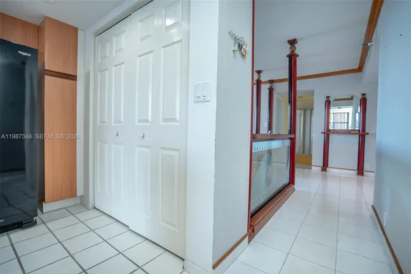 a living room with furniture rug and window