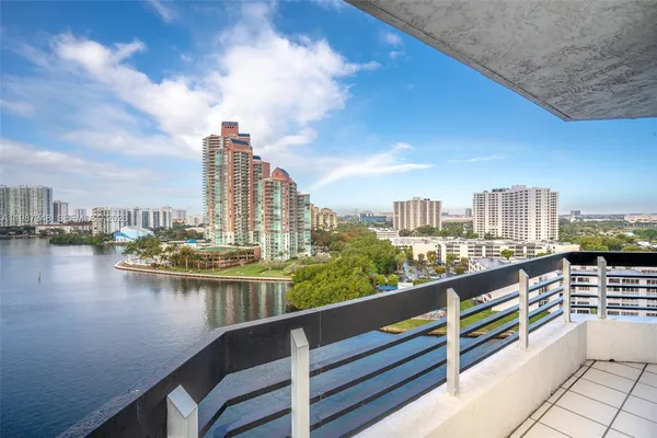 a city view with tall buildings and a lake view