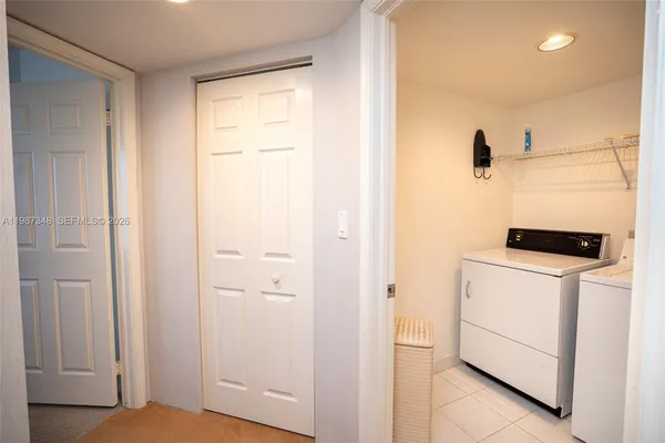 a view of a hallway with front door