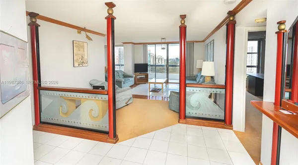 a view of a living room with a large window and a fireplace