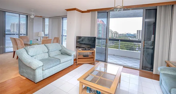 a living room with furniture and a rug