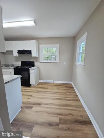 a kitchen with a stove and a refrigerator