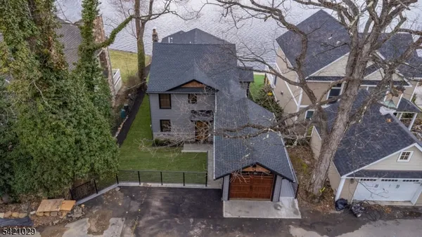 front view of a house with a tree