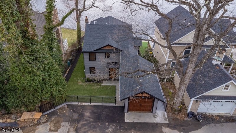 front view of a house with a tree