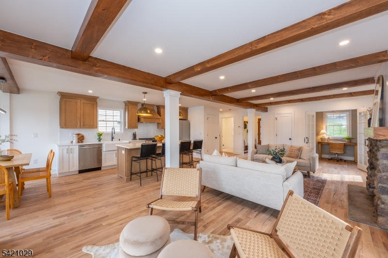 43 East Shore Road Denville, NJ 07834 - Photo 17 of 45 a living room with fireplace furniture and a wooden floor