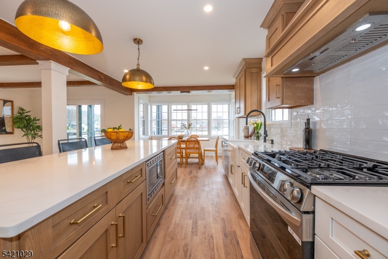 43 East Shore Road Denville, NJ 07834 - Photo 18 of 45 a kitchen with stainless steel appliances granite countertop a stove and a wooden floors