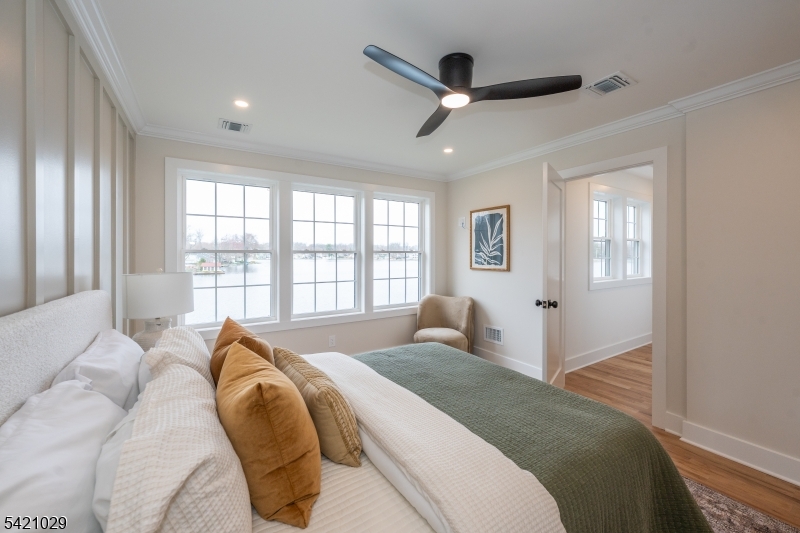 43 East Shore Road Denville, NJ 07834 - Photo 22 of 45 a spacious bedroom with a large bed and a large window