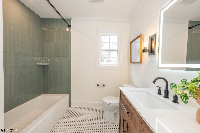 43 East Shore Road Denville, NJ 07834 - Photo 27 of 45 a bathroom with a sink a toilet a tub and shower