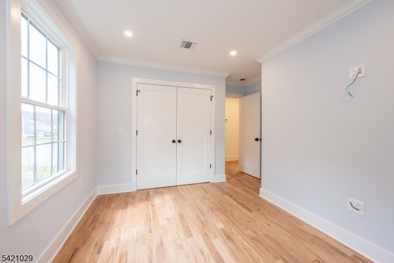 43 East Shore Road Denville, NJ 07834 - Photo 29 of 45 a view of empty room with wooden floor and fan