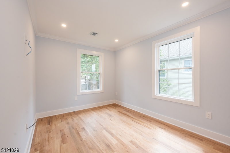 43 East Shore Road Denville, NJ 07834 - Photo 30 of 45 a view of an empty room with wooden floor and a window