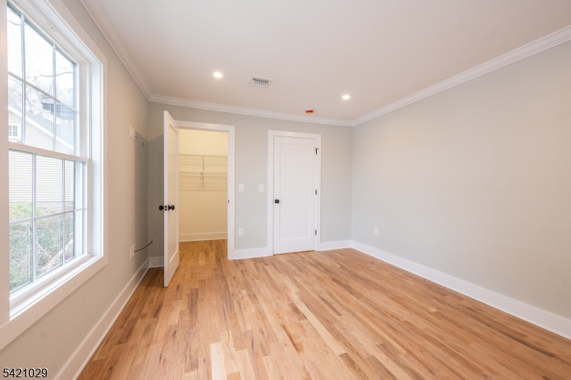 43 East Shore Road Denville, NJ 07834 - Photo 32 of 45 a view of empty room with wooden floor and fan