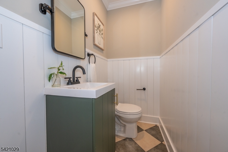 43 East Shore Road Denville, NJ 07834 - Photo 37 of 45 a bathroom with a sink and a mirror