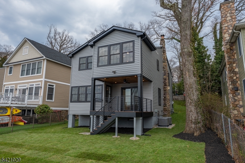 43 East Shore Road Denville, NJ 07834 - Photo 39 of 45 a view of a house with a yard and sitting area