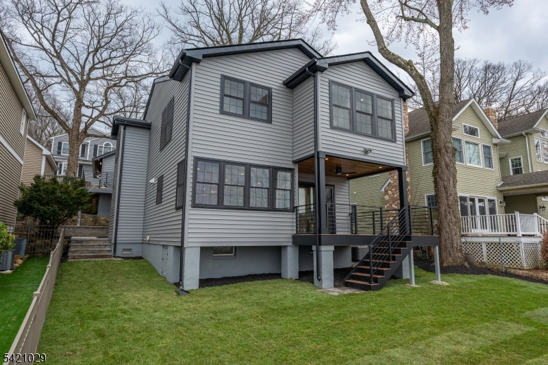 43 East Shore Road Denville, NJ 07834 - Photo 40 of 45 a view of a house with a yard and sitting area