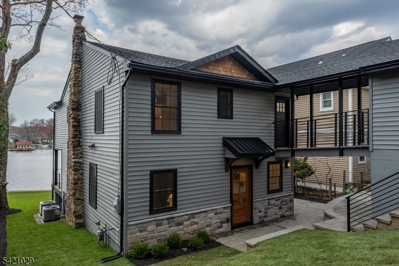 43 East Shore Road Denville, NJ 07834 - Photo 5 of 45 a front view of a house with garden
