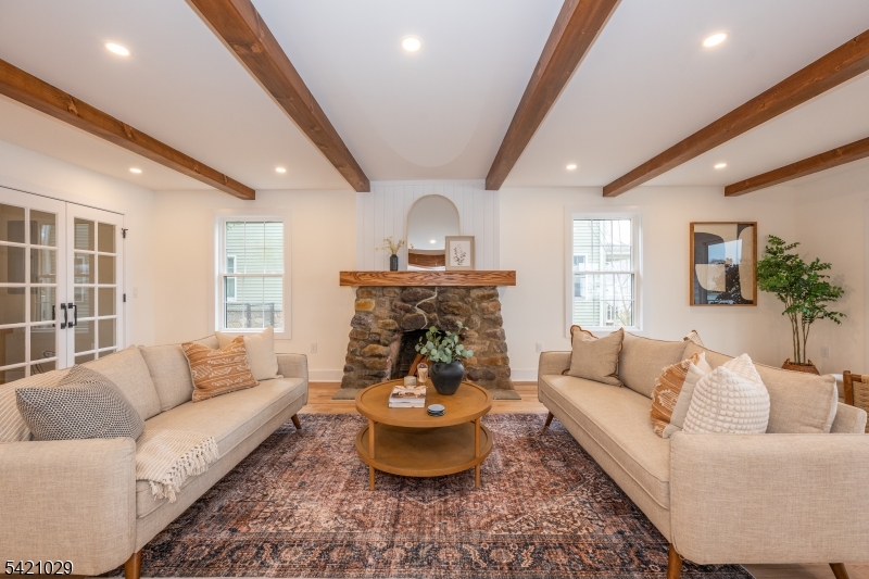 43 East Shore Road Denville, NJ 07834 - Photo 7 of 45 a living room with furniture and a large window