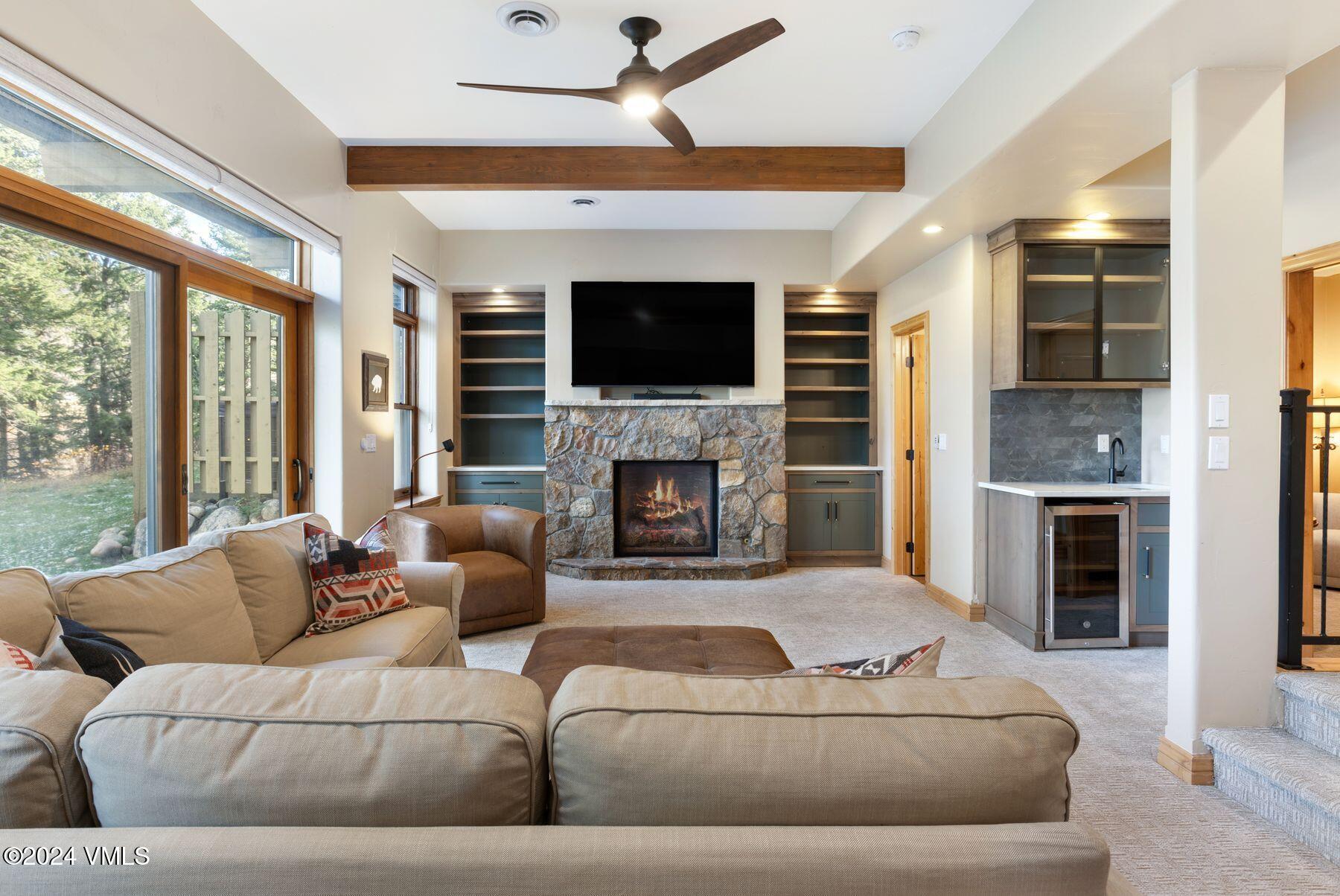 39555 Highway 6, Unit E Avon, CO 81620 - Photo 11 of 42 a living room with furniture fireplace and flat screen tv