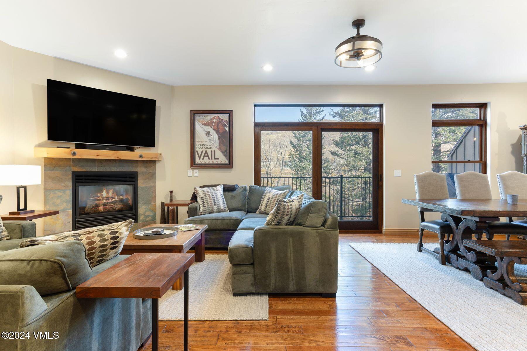 39555 Highway 6, Unit E Avon, CO 81620 - Photo 18 of 42 a living room with furniture fireplace and a flat screen tv