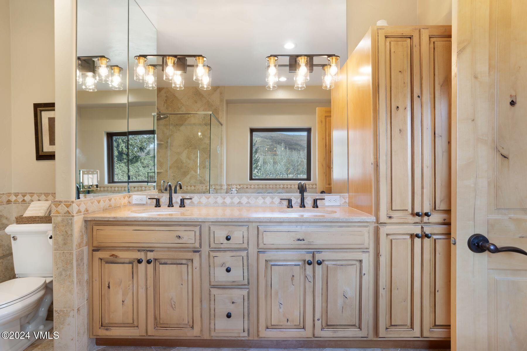 39555 Highway 6, Unit E Avon, CO 81620 - Photo 26 of 42 a bathroom with a double vanity sink mirror and double