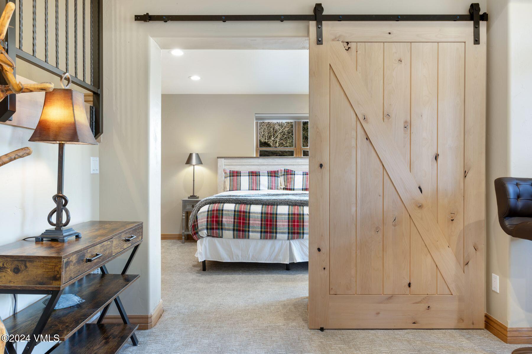 39555 Highway 6, Unit E Avon, CO 81620 - Photo 32 of 42 a bedroom with a bed and a table