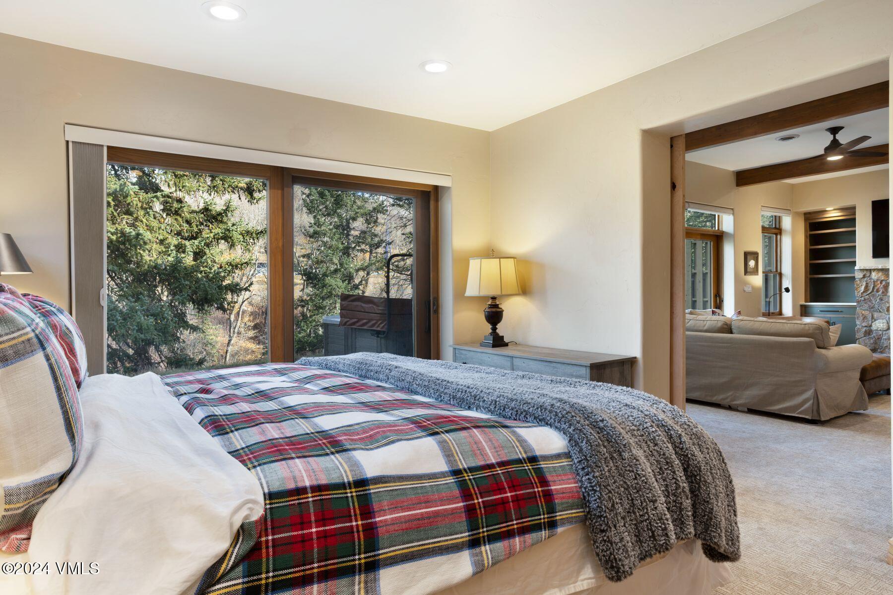 39555 Highway 6, Unit E Avon, CO 81620 - Photo 33 of 42 a bedroom with a bed and glass window