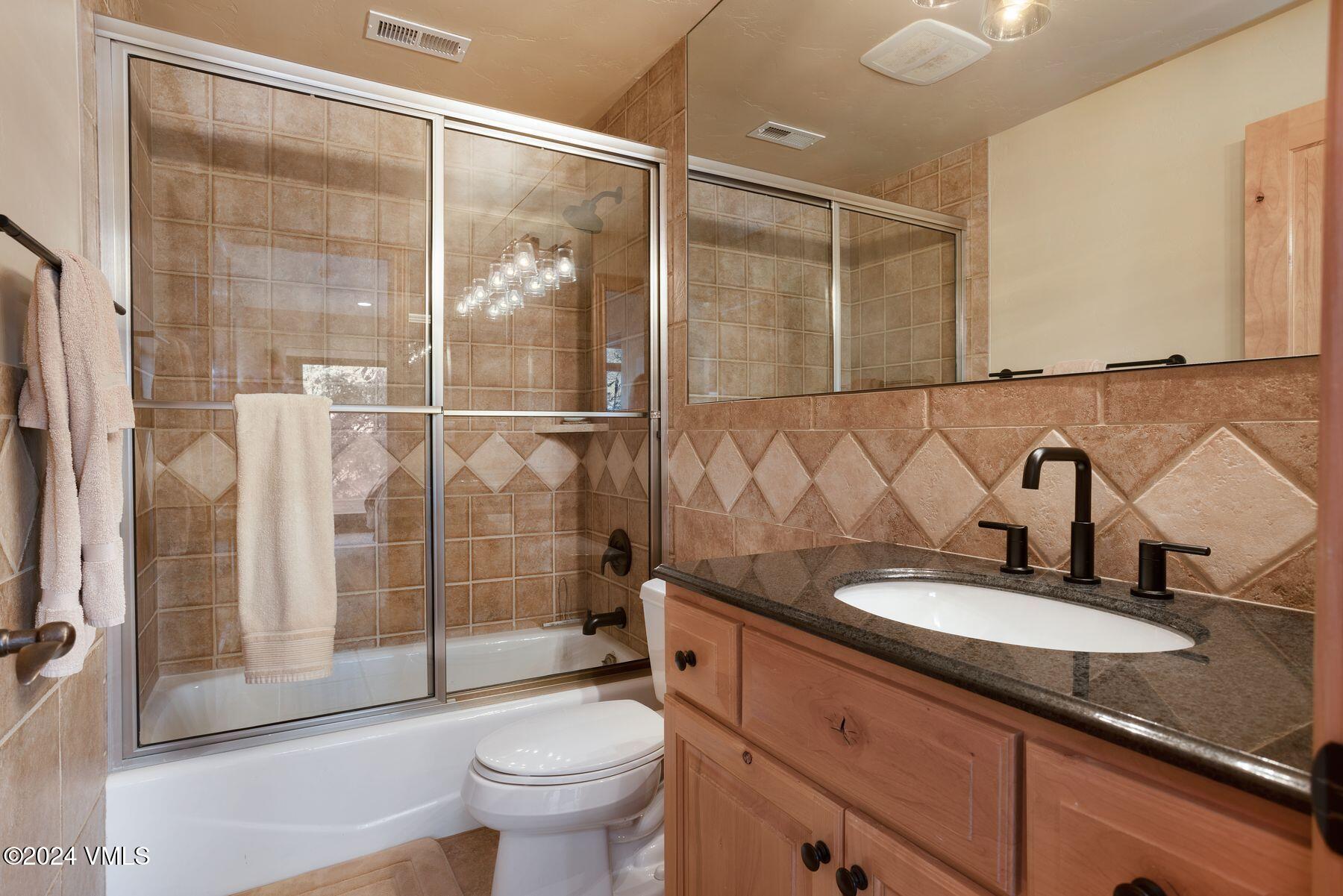 39555 Highway 6, Unit E Avon, CO 81620 - Photo 34 of 42 a bathroom with a sink and a mirror