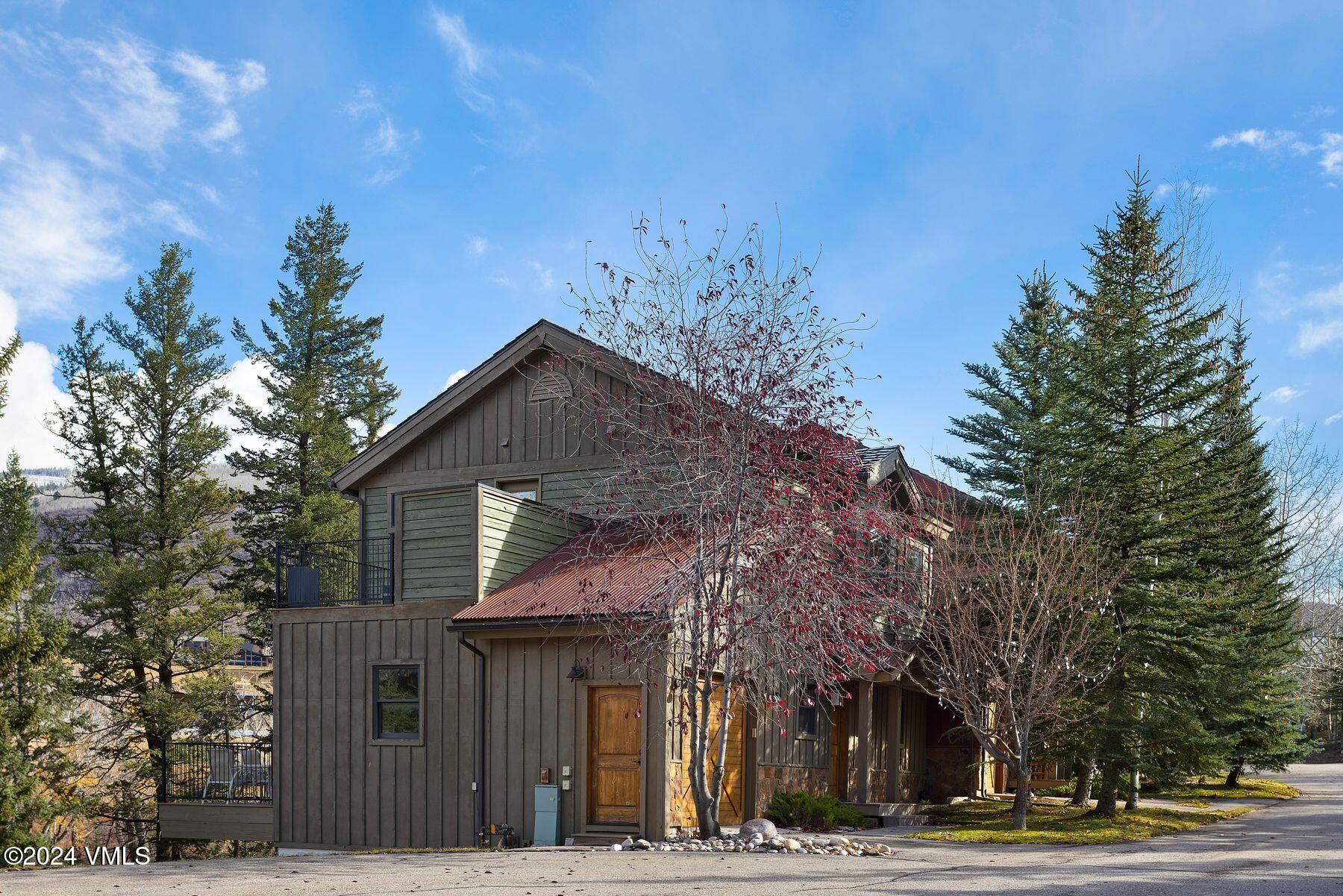 39555 Highway 6, Unit E Avon, CO 81620 - Photo 37 of 42 a front view of a house with a yard