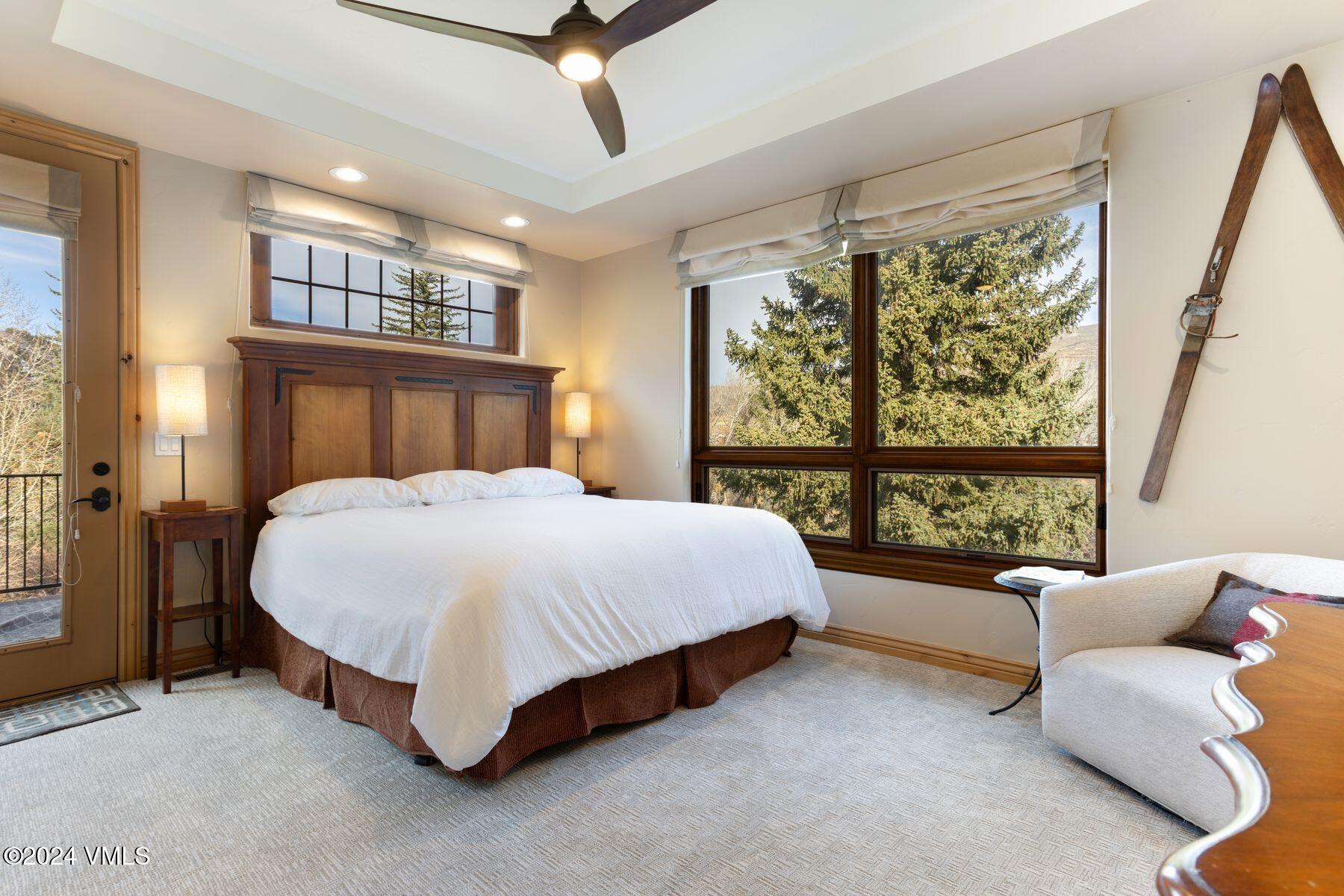 39555 Highway 6, Unit E Avon, CO 81620 - Photo 5 of 42 a large bed sitting in a bedroom next to a large window