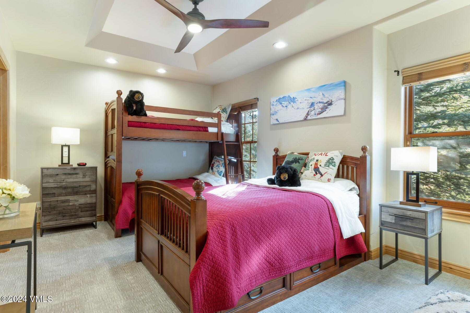 39555 Highway 6, Unit E Avon, CO 81620 - Photo 7 of 42 a bedroom with a bed and wooden floor