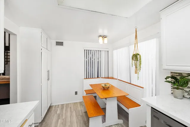 a workspace with furniture and window