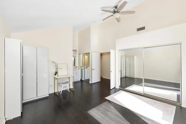 a view of a workspace with furniture and a potted plant