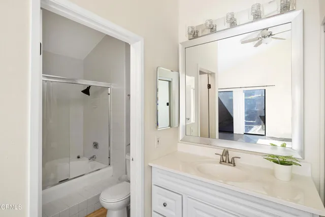 a view of hallway with a potted plant