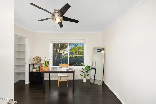 a view of living room with furniture and wooden floor