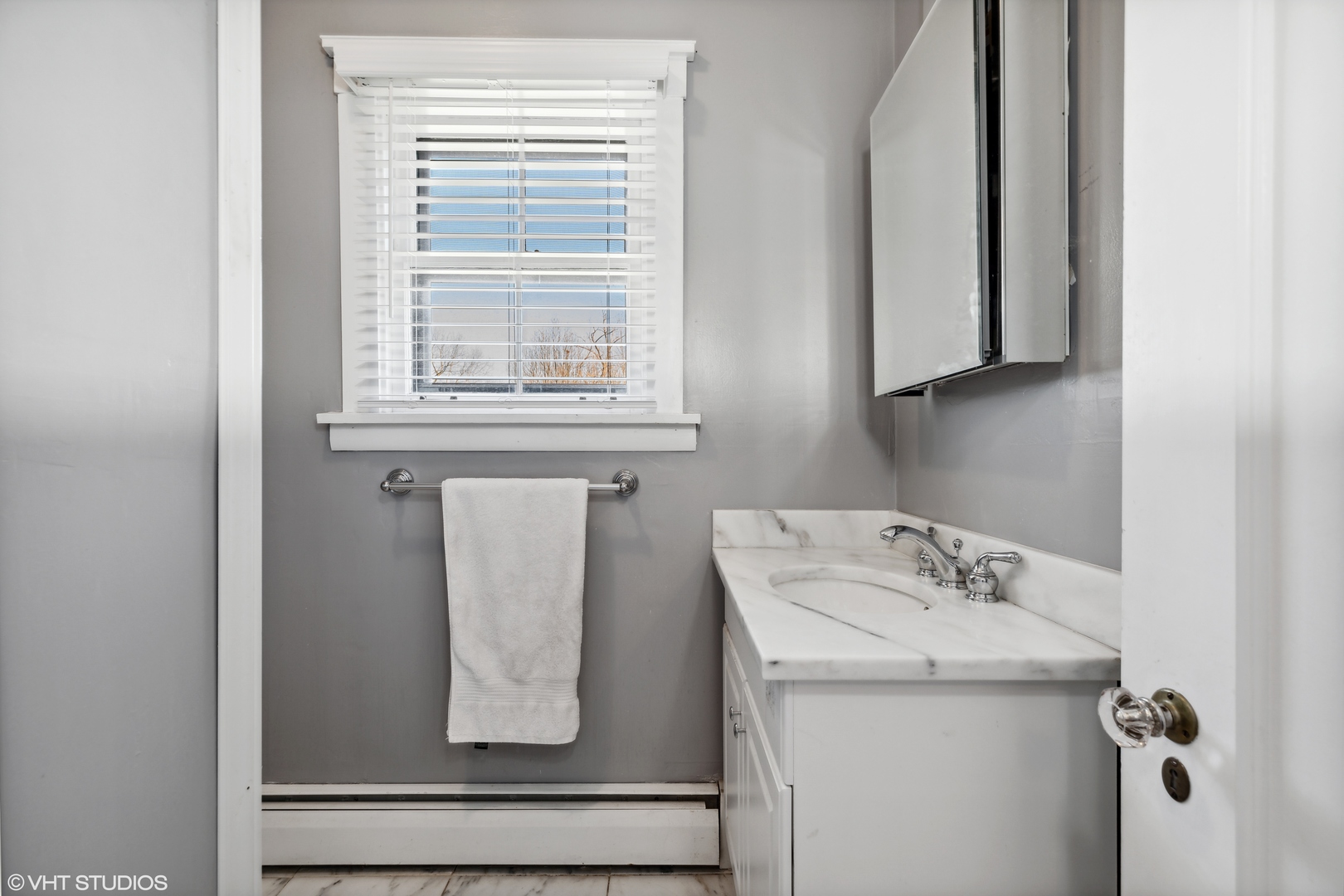 17859 Howe Avenue Homewood, IL 60430 - Photo 16 of 25 a bathroom with a sink and a mirror