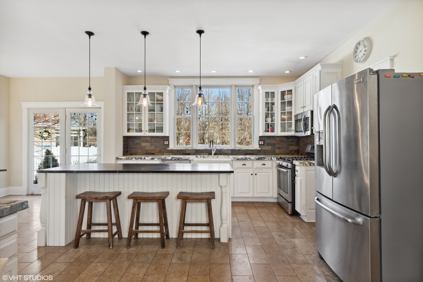 17859 Howe Avenue Homewood, IL 60430 - Photo 5 of 25 a kitchen with refrigerator a island and chairs