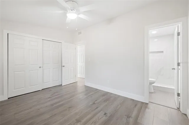 an empty room with wooden floor
