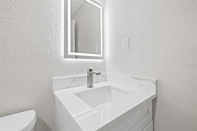 a bathroom with a sink and a toilet