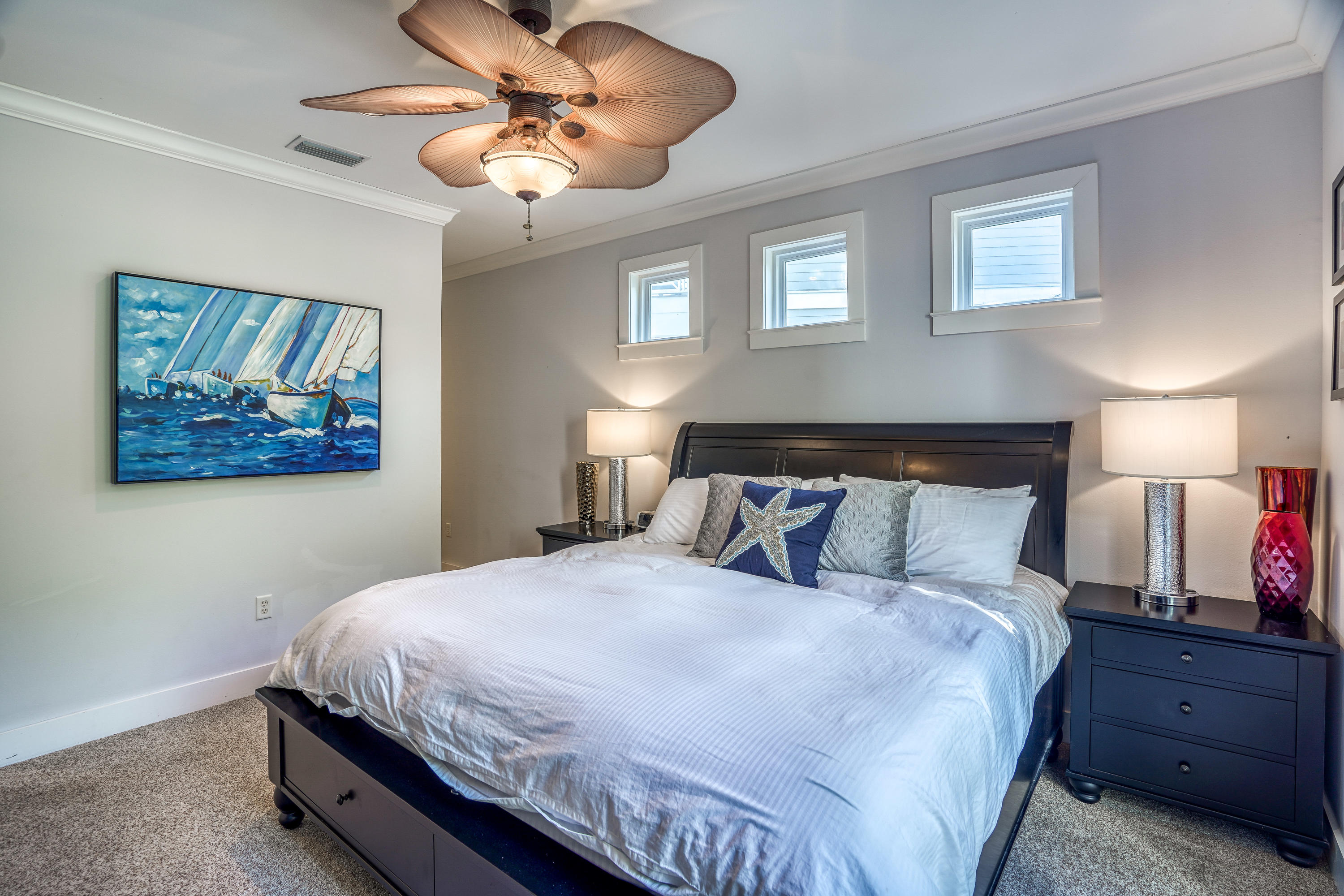 43 Lifeguard Loop East Inlet Beach, FL 32461 - Photo 14 of 44 a bedroom with a bed and a chandelier